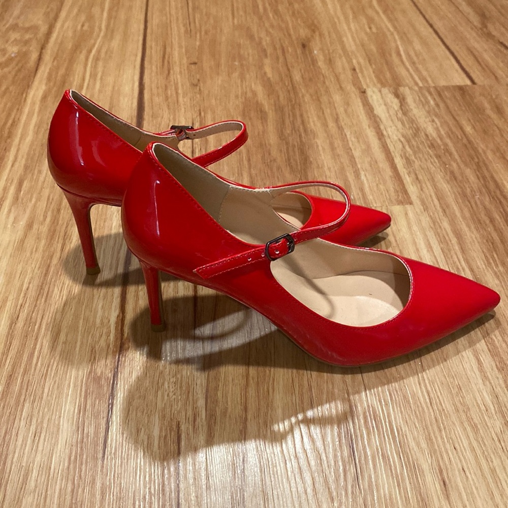 Red pointed toe stiletto heels with ankle strap